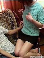 A skinny redhead gives head to a young guy